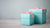 Two Light Blue Gift Boxes with Pink Ribbons sitting on Wooden Surface | Nikki Darling Australia